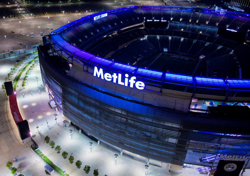 MetLife Stadium Solar Ring Project at night. Our 1400 custom modules have RGB LEDs below the glass. This creates a mood ring for the entire stadium. Immediately after ring was installed Hurricane Sandy arrived. No problem, even though the ring is 185' above ground level.